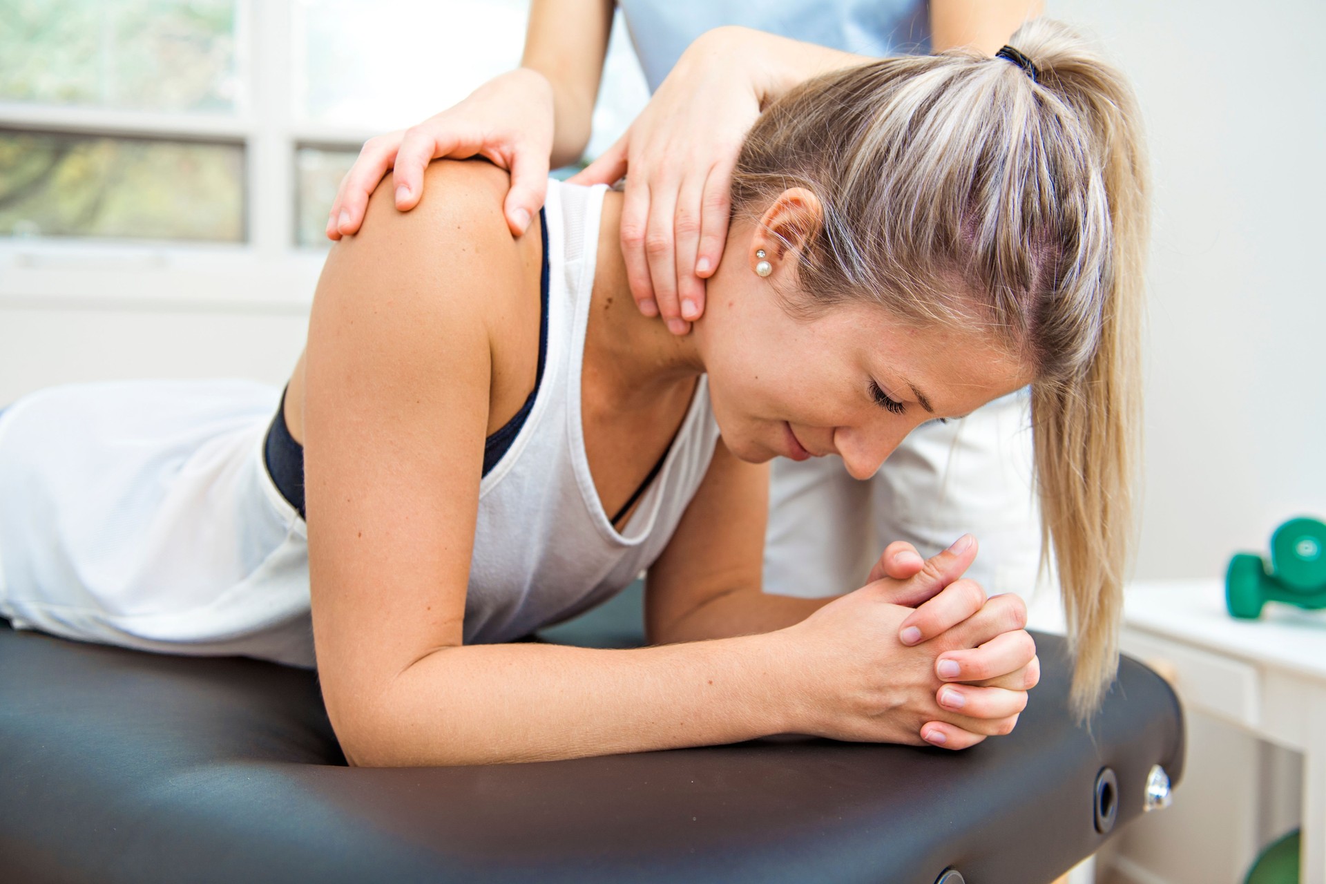 A Modern rehabilitation physiotherapist at work with client