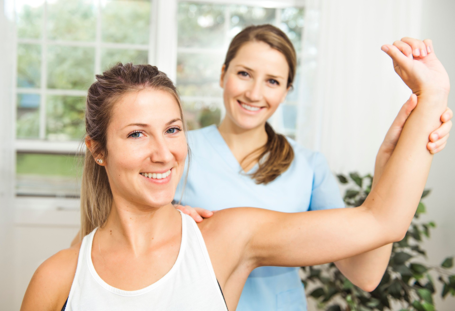 A Modern rehabilitation physiotherapist at work with client