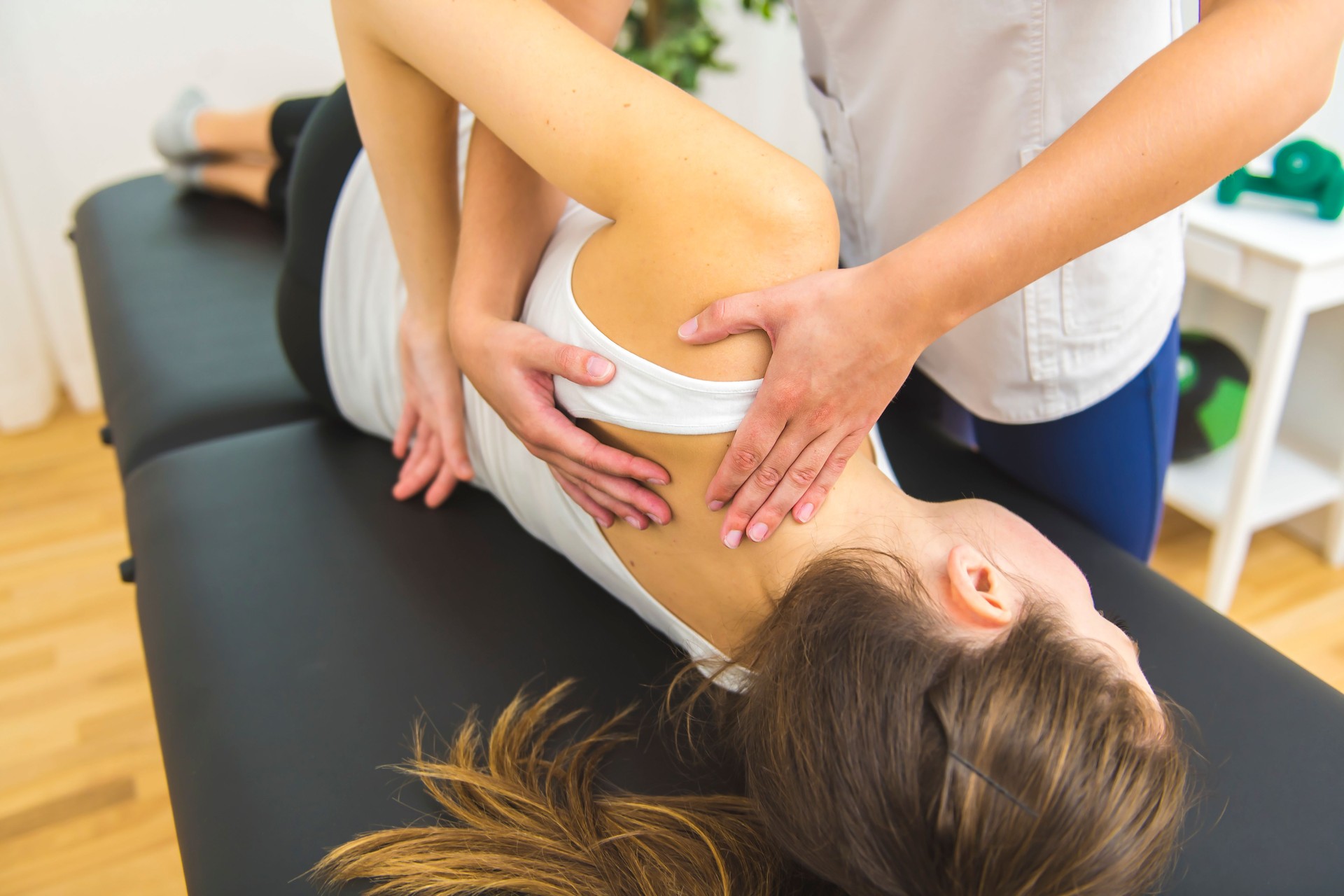 A Modern rehabilitation physiotherapist at work with client