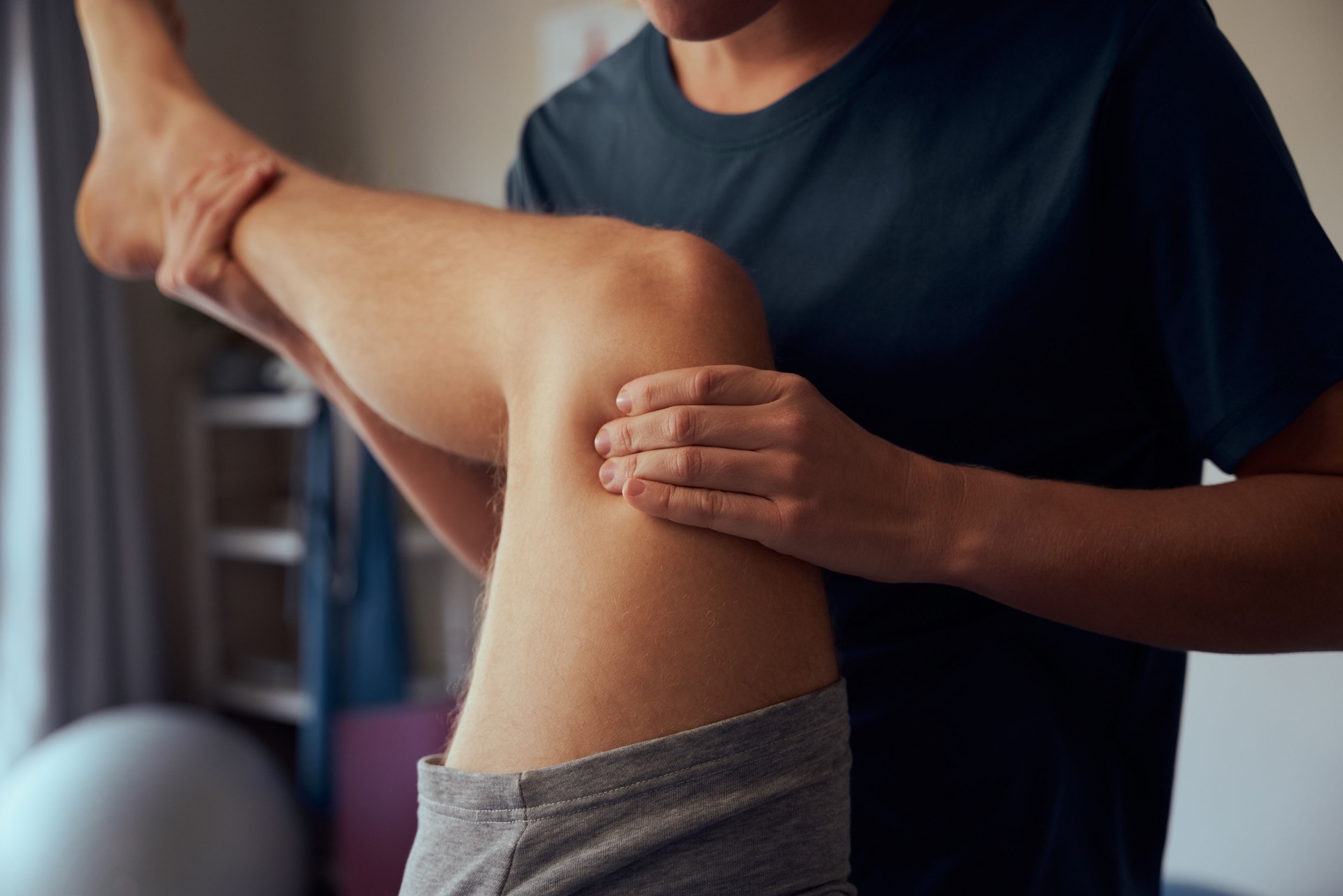 Closeup of physiotherapist hands giving therapy treatment to patient